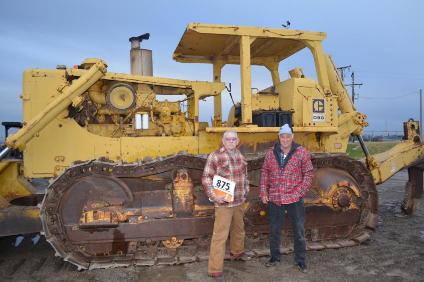 Burney Owens (R) buys older Cat equipment like this 1973 D9G. While he tends to collect older equipment, according to friend John Christian, Owens also puts the vintage machines at work in his construction business. Owens and Christian traveled from Jay, Okla., to the Fort Worth sale.

