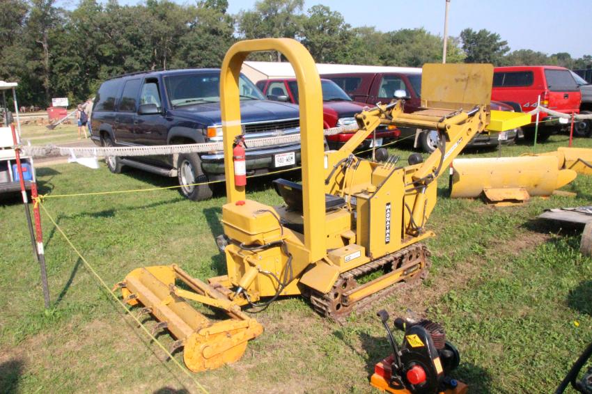 For many years, Struck Corporation has produced a line of tiny crawler tractors and loaders. This is a Magnatrack Junior.
(HCEA photo)