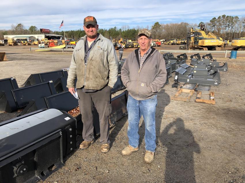 Interested in the skid steer loader attachments are Jason Hoxit (L) of RJC Construction in Rosman, N.C., and Denny Whitmire of Jerry T. Whitmire Grading in Brevard, N.C.