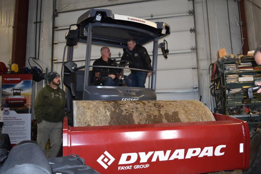 Troy Franks, general superintendent of the paving division of Glenn O. Hawbaker Inc., used the walk-around time to get a hands-on lesson from the Dynapac representatives.
