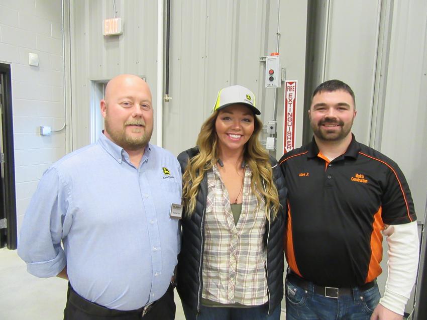 (L-R): Mike Tube, Murphy Tractor & Equipment’s region product support manager of the Midwest Region, welcomes sister-and-brother team Ashley and Mark Szakacs Jr. of Mark’s Construction at the Brunswick Open House. 
