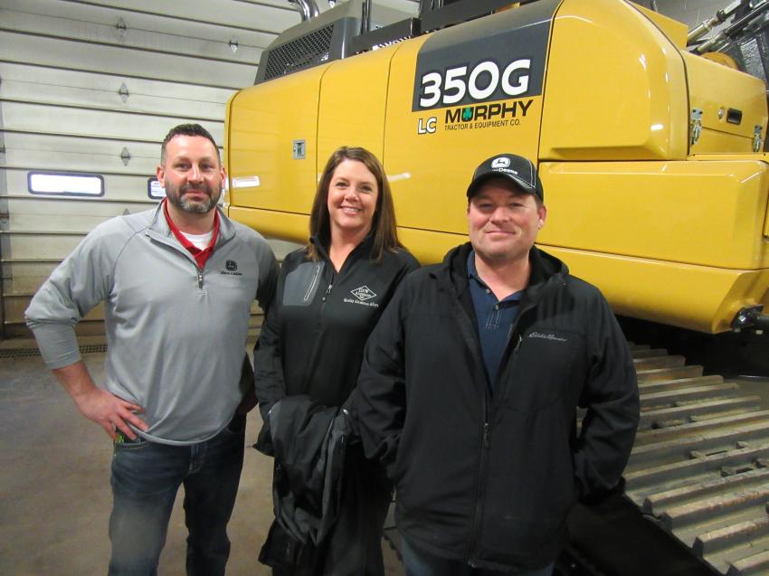 (L-R): Murphy Tractor & Equipment’s Shawn Vallelonga welcomes Devon and Nathan Hoopes, of GNW Aluminum, to the Canton Branch Open House and thanks them for their purchase of this John Deere 350G excavator. 
