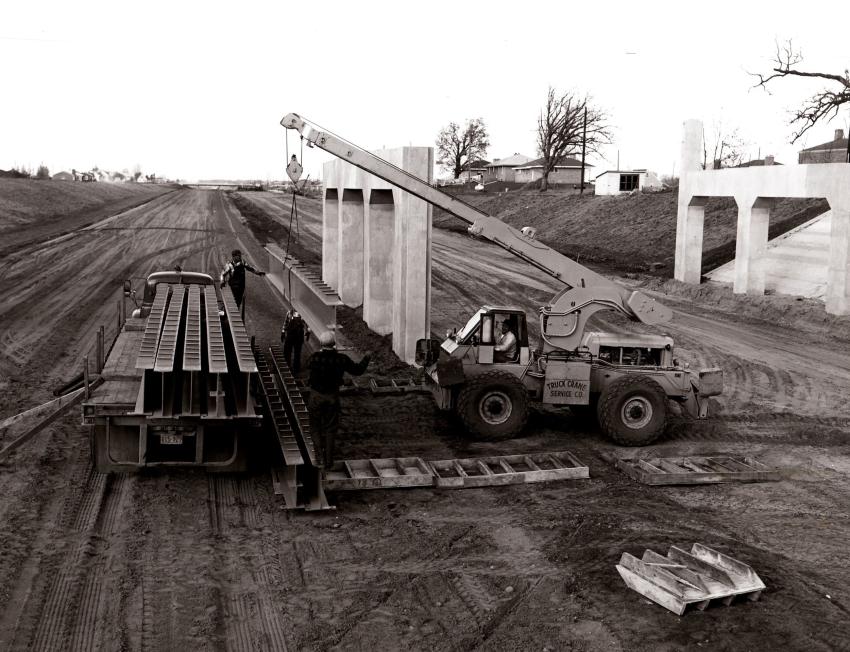 An Austin-Western hydraulic crane owned by Truck Crane Service Company unloads 32-ft., 1-ton bridge beams during construction of U.S. 65 near Minneapolis, Minn., in 1957. Austin-Western developed the first hydraulic crane, nicknamed the “Anteater,” for military service in World War II, and Grove Manufacturing perfected the industrial hydraulic crane in 1952.
(Austin-Western Division of Baldwin-Lima-Hamilton photo, HCEA Archives)