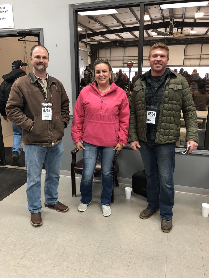 (L-R): Brian Jones and Heather Gates of PSC&C in Lexington, S.C., planned to bid on the trucks along with Jordan Brown of JHB Grading in Lexington, S.C.