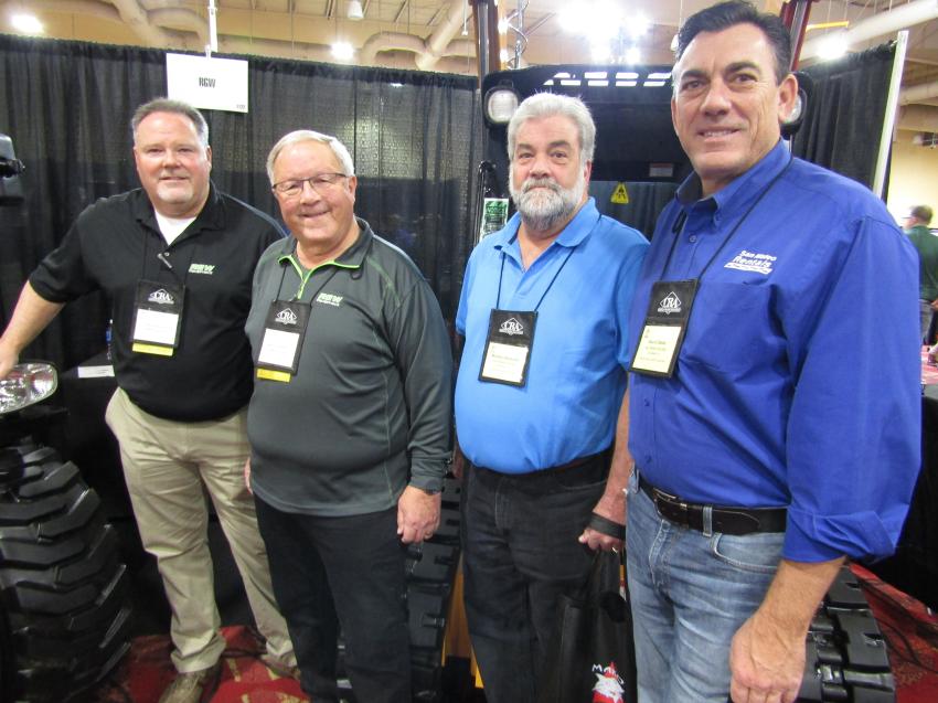 (L-R): Paul and Warren Hanson of RGW Equipment discuss the Mustang skid steer loader’s capabilities with Murphy Demartini and Kevin Diede of San Mateo Rentals, customers for more than 21 years.
