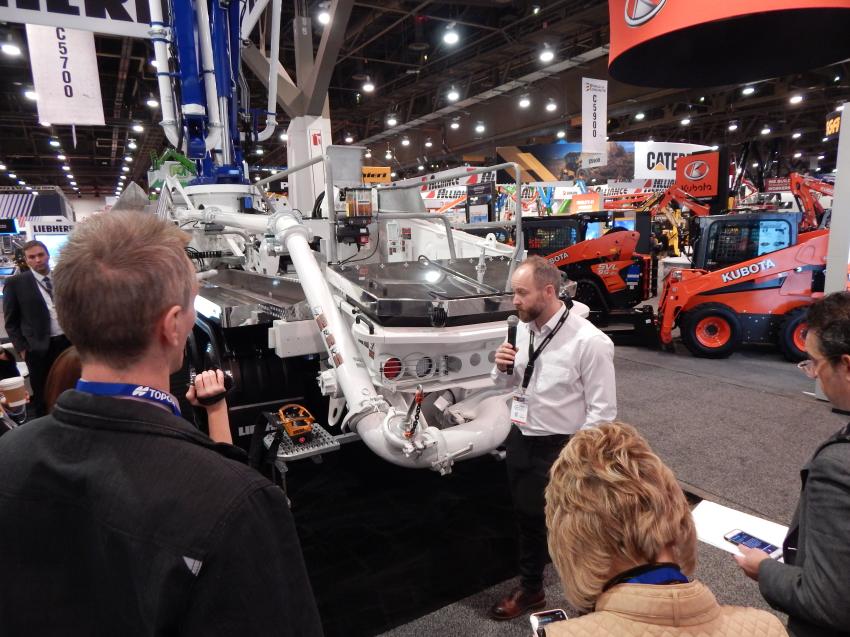 At the Liebherr press conference, Clint Nichols, regional sales manager, introduces the new 42 M5 XXT truck-mounted concrete pump debuting at WOC . The 42 M5 XXT with 5-part multi-fold distributor booms could be brought under 32-ton operating weight due to a completely new development and the use of in-house components.