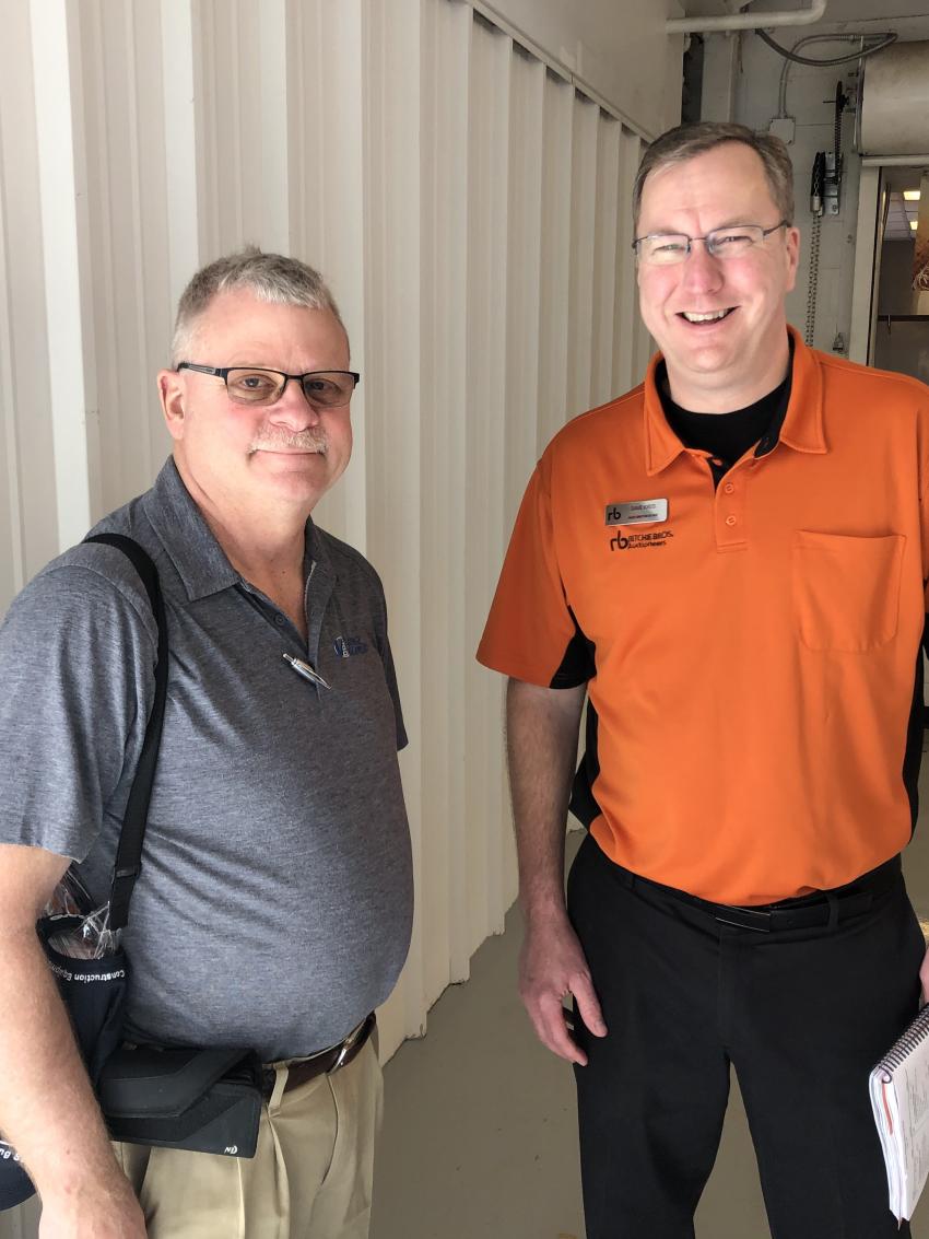 Todd Kaley (L) of Upstate New York’s Volvo dealer, Vantage Equipment, and Dave Kreis, northeast regional director of Ritchie Bros. Volvo and Ritchie Bros. teamed up this year to sell the Volvo gold rush excavator for charity at this year’s sale.