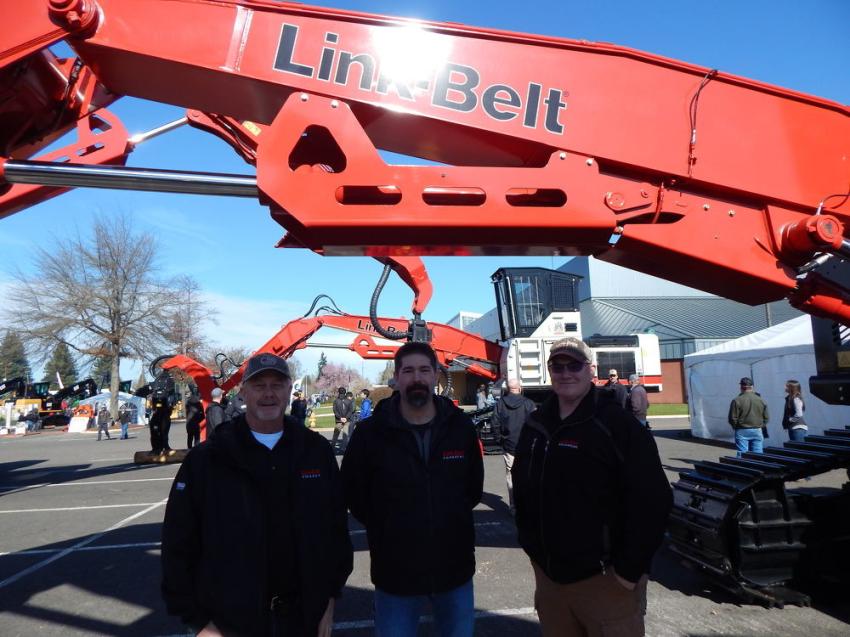 (L-R): Retired President, current board member of Triad Machinery, Doug Summers, Portland, Ore., with Link Belt Excavators Regional Manager Chad Kline, and Product Support Manager Justin Conn, Lexington Ky., fronting a LBX 3740 Excavator.