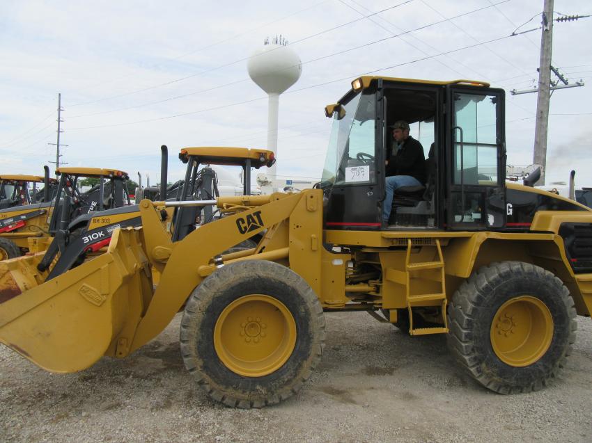 Ilya Prediy of Prediy’s Lumber puts a Cat 914G wheel loader through its paces at the auction in Findlay. 
