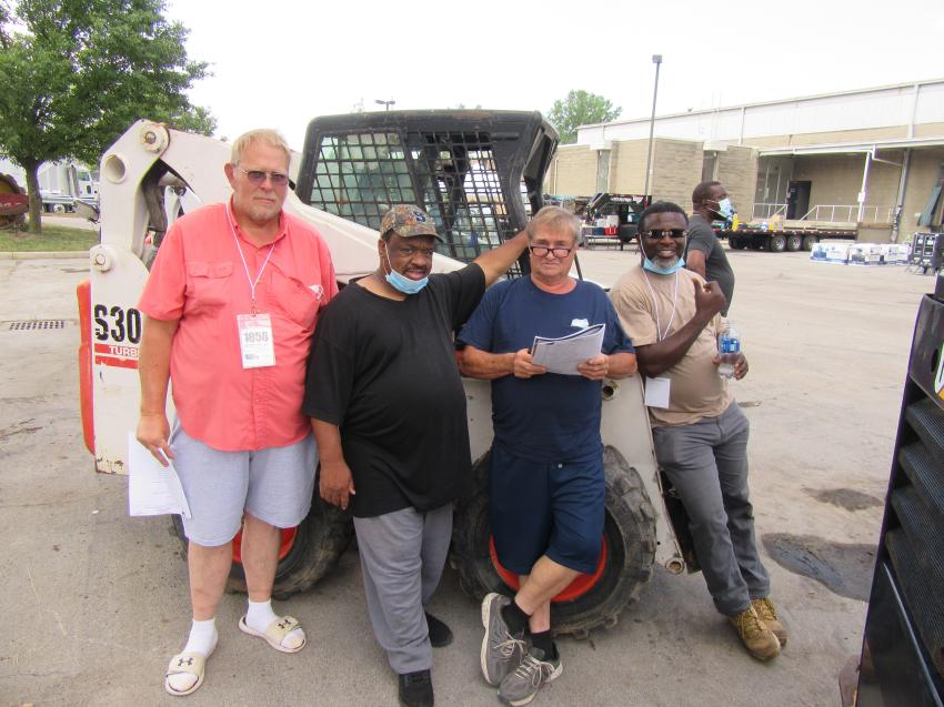 (L-R): Ed Workman of S&L Core joined Calvin Jewel of Hauling Solutions, Bill Jenkins and John Effah of Direct Trucking and Repair in search of skid steers and trucks at the auction.