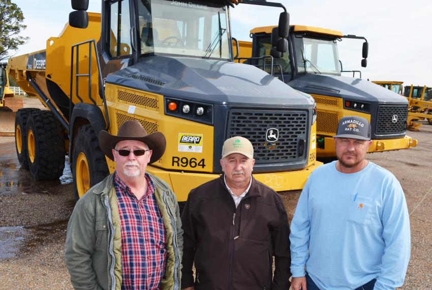 Some Bruce, Miss.-based independent contractors looking over some of the heavy iron, including a pair of Deere 260E articulated trucks, (L-R) are Robert Taylor, Daniel Gregory and Jason Gregory. (CEG photo)