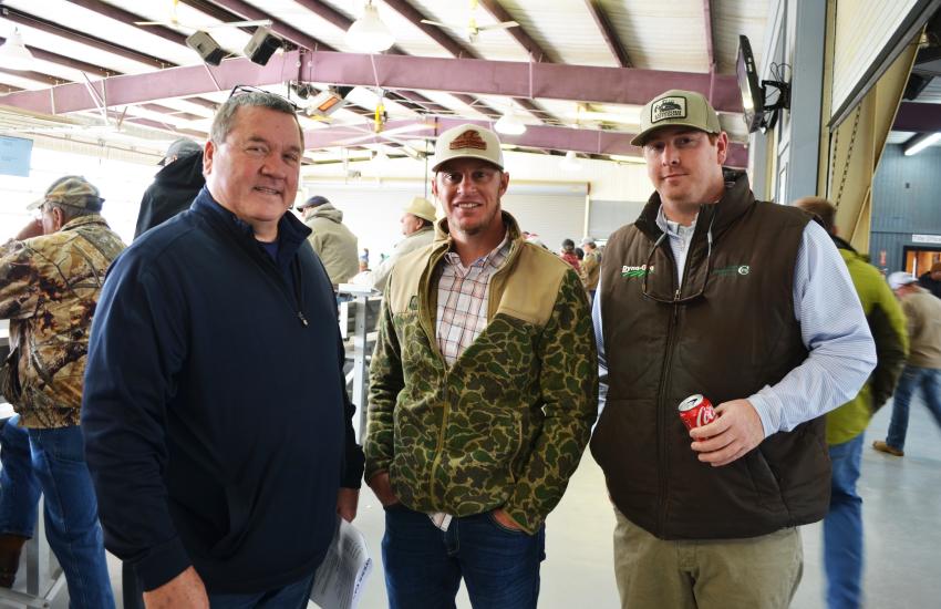 (L-R): Deanco Auction’s Donnie Dean extends a warm welcome to his customers and guests at the sale, including Don Wainwright of C&C Excavating, Live Oak, Fla., and Tate Presley, LowBird Outdoors, Tuscaloosa, Ala. (CEG photo)