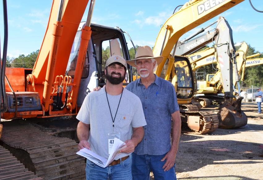 Jonathan Tarver (L) of Tarver Farms, Jackson, Ala., and his grandfather, Leonard Wright, were interested in some of the mid-sized excavators for the farm and to expand into the dirt moving business. (CEG photo)