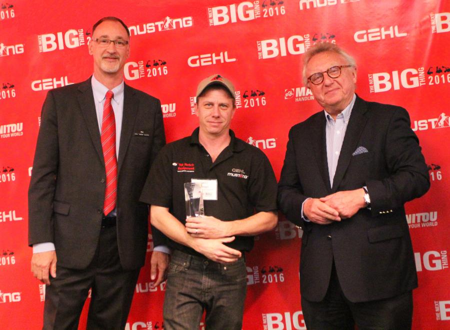 Dan Miller, President & CEO of Manitou Americas, and François Piffard, Executive VP of 
Sales and Marketing for Manitou Group, present the 2015 Mustang Top Dealer Award to 
Harold Fleegel of A Top Notch Equipment.