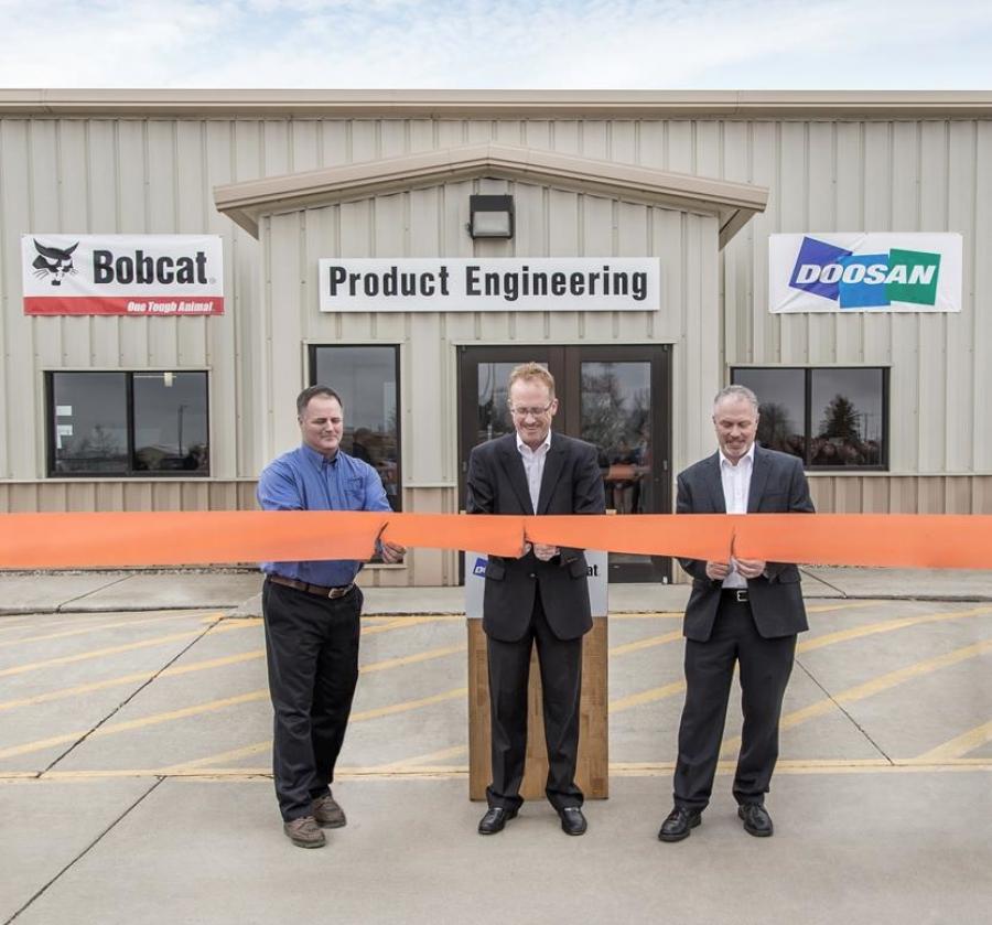 Rich Goldsbury, President, Bobcat and Doosan North America and Oceania (middle) was recently joined by Gwinner Mayor Dan McKeever (left) and members of the Gwinner City Council for a ribbon cutting ceremony at the Gwinner engineering facility. The renovation project is part of an ongoing investment to help enhance work environments, accommodate growth , drive innovation and improve operations across the organization.