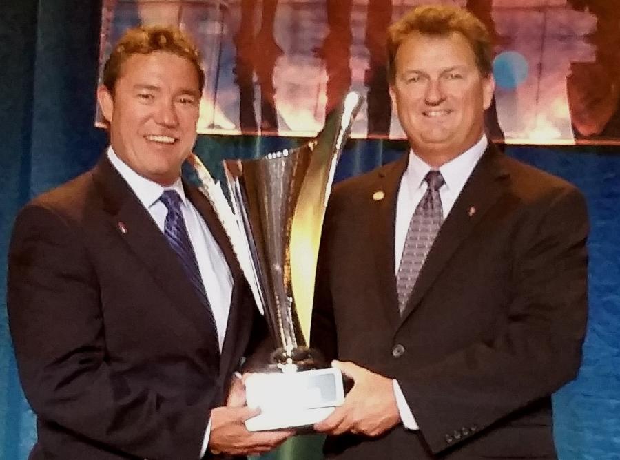 Harry Mamizuka (L) and Tom Bertolino, vice president and a dealer principal, receive the 2016 Truck Dealer of the Year award from the American Truck Dealers (ATD) at the 53rd annual ATD Convention and Expo.