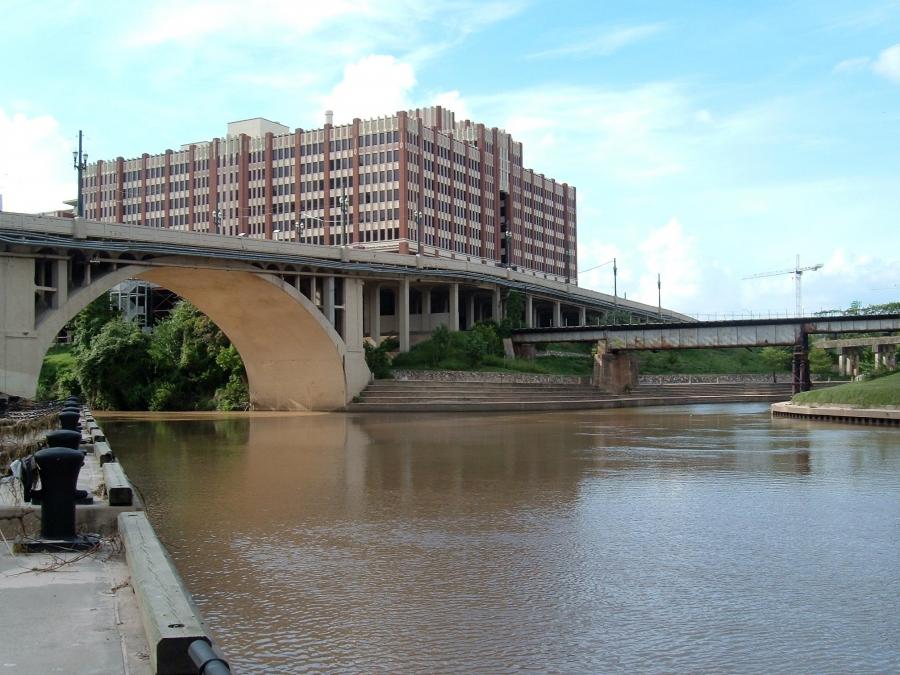 Lined by concrete surfaces to better channel floodwaters, the bayou northwest of downtown draws walkers and bikers to its walkways, but much of the corridor is hardly a scenic gathering place.