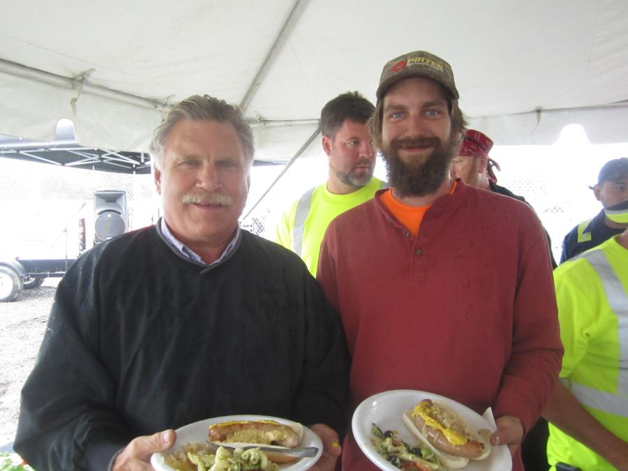 Scott Sinnett Sr. (L) and Scott Sinnett Jr., owners of Sinnett Excavating, enjoy the catered lunch.