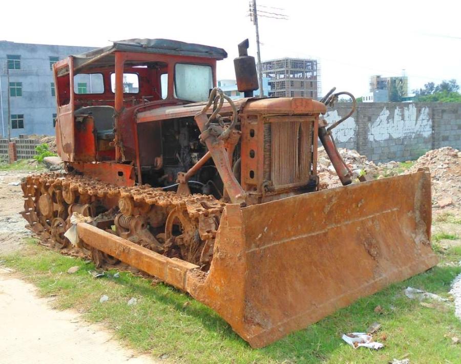 An early model (First Tractor Company) tractor, still operational, in Xinbu Island, Hainan Province, China. 
(Anna Frodesiak photo)