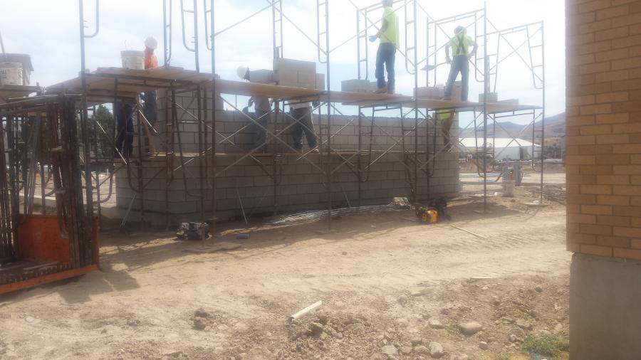 Idaho Division of Public Works photo.	
Masons are on site installing the concrete masonry units in several areas for the walls.