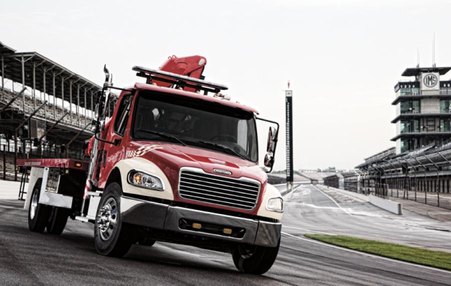 Freightliner trucks pitch in at racing events by clearing track of debris, safely removing wrecked cars from the track and moving TV production and hospitality equipment from track to track.