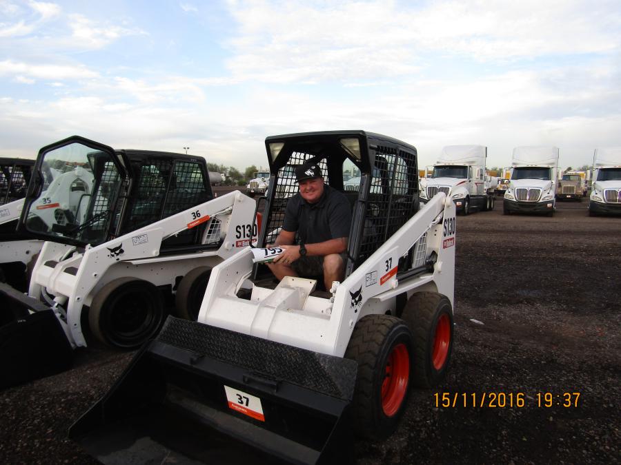 Chris Collinsworth of Pacific Construction in Highland, Calif., tests out this Bobcat 5130 skid steer loader.