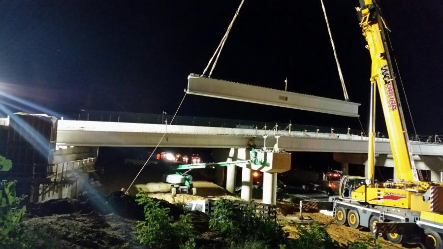 Crews lift beams into place at the site of a new four-lane Interstate 95 overpass on Fall Hill Avenue in the city of Fredericksburg.