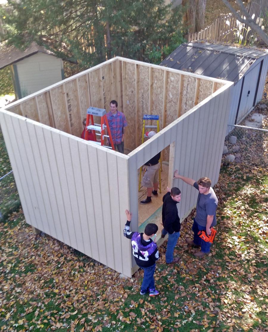 Students in the Ralston High School advanced woods and construction class put up the walls of the shed they built and gave to football coach Jason Fink on Nov. 3. The students built the shed in class in just under two months.