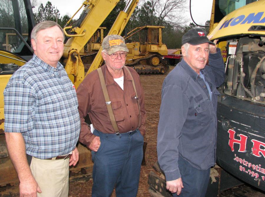 (L-R): Ricky Dukes, Williams Truck & Equipment, Tampa, Fla.; Leonard Hairel, contractor based in Fort Payne, Ala.; and Danny Wagner, Wagner Excavation, Fort Payne, Ala., look over some of the mini-excavators at the auction.