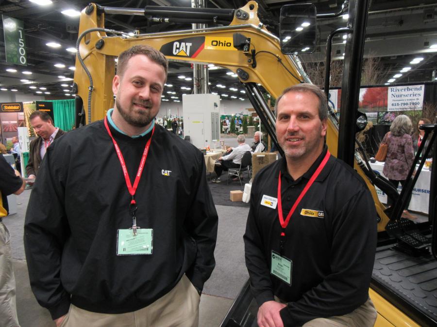 Tom Miller (L), Caterpillar, joins Brian Speelman, Ohio CAT, to welcome attendees to the Ohio CAT booth.