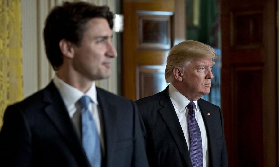 Photo by Andrew Harrer/Bloomberg U.S. President Donald Trump (right) and Justin Trudeau, Canada's prime minister, arrive to a news conference in the East Room of the White House in Washington, D.C.,on Monday.