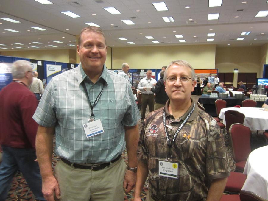 David Sivill (L) of Central Stone Co. and Don Sobolewski of Chapel Steel tour the associates expo area.