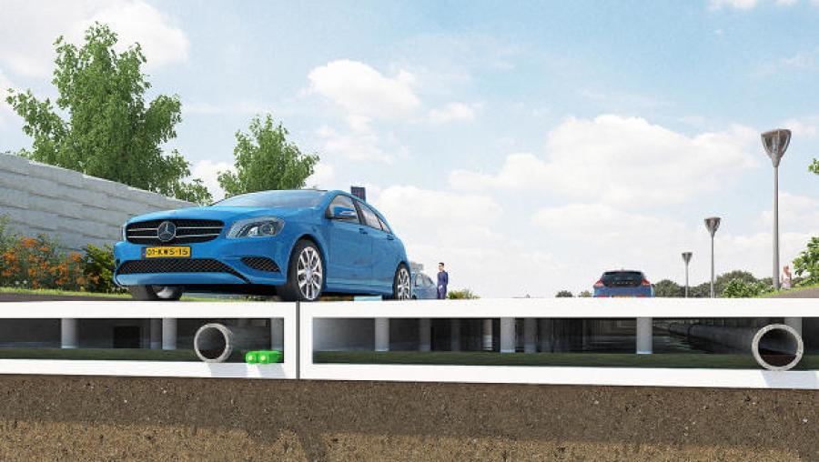 The plastic roads are modular and can house pipes in between the pieces and the ground.