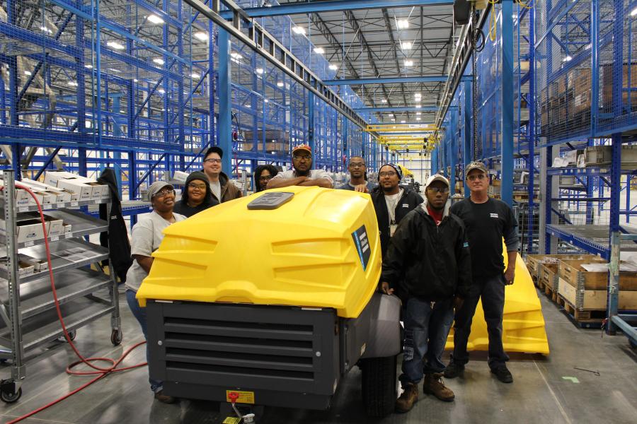 Atlas Copco engineers, product managers and production crew celebrate the first compressor to roll off of the production line at the company’s new Rock Hill, South Carolina, plant.