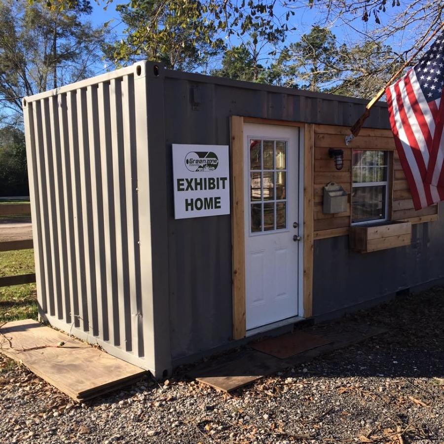 Green Zone Housing photo. Scores of volunteers will modify the container with things like insulation, air conditioning, electrical outlets, kitchen appliances and a shower and toilet. Then the keys will be given to a military veteran in need of a home.
