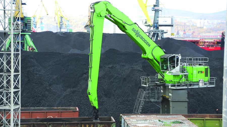 Approximately 5,291 tons of coal arrive at Murmansk port by railcar every day. They are unloaded by a Sennebogen 875 with a Green Hybrid Energy Recovery System built on a crawler portal undercarriage and equipped with a 6.5 cu. yds. (5 cu m) clamshell bucket