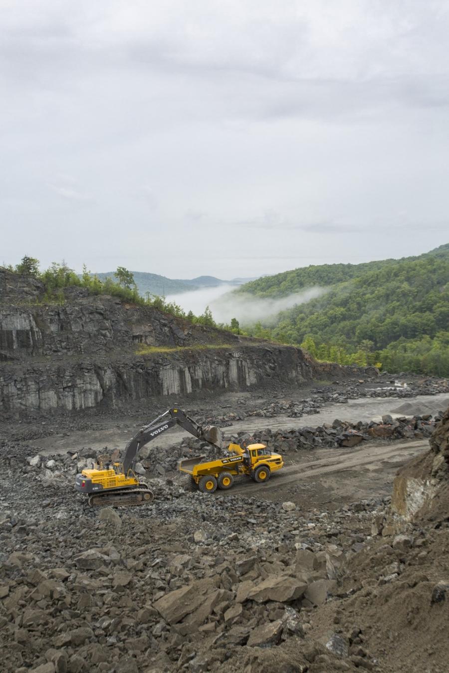 A Volvo excavator and articulated hauler work together on the Barton mine.
