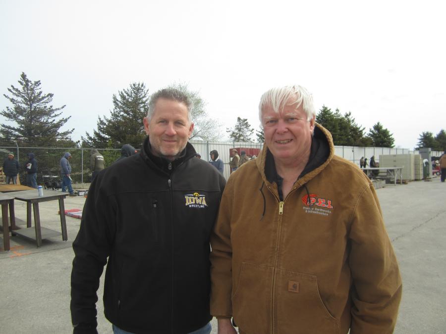 Bud Pecoy (L), Mid Country Machinery Inc., and Art Bayley, 1st Source Bank, attend the auction.