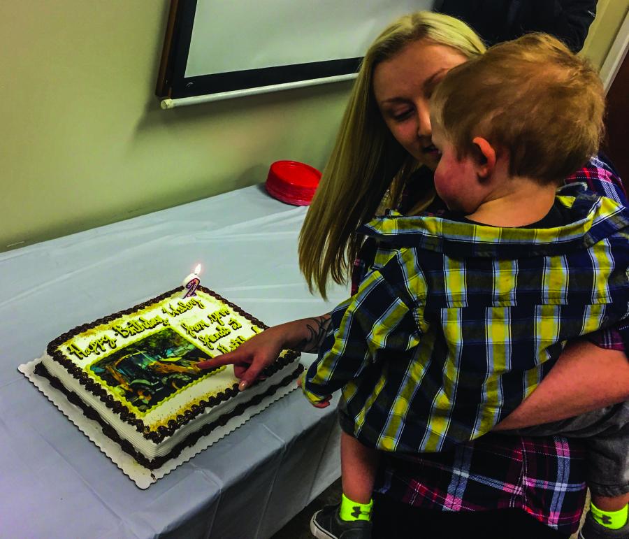 Wesley’s mother showing him his birthday cake