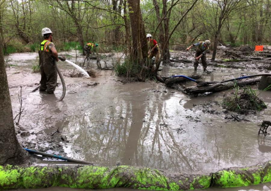 Workers assess a spill by Rover Pipeline affecting approximately 500,000 square feet of wetlands on April 27, 2017 in Stark County, Ohio. File Ohio EPA