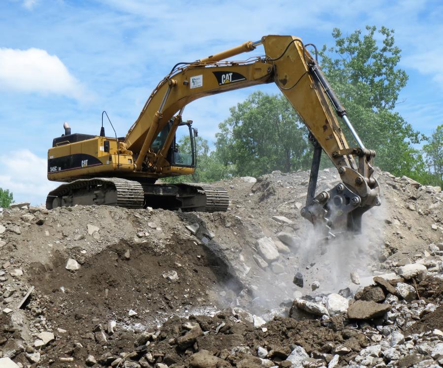 Brad Pelella of Profex channels the power of the Strickland SCP80 Mechanical Concrete Pulverizer through a CAT 345C L Excavator at the firm’s yard in Newburgh, N.Y.