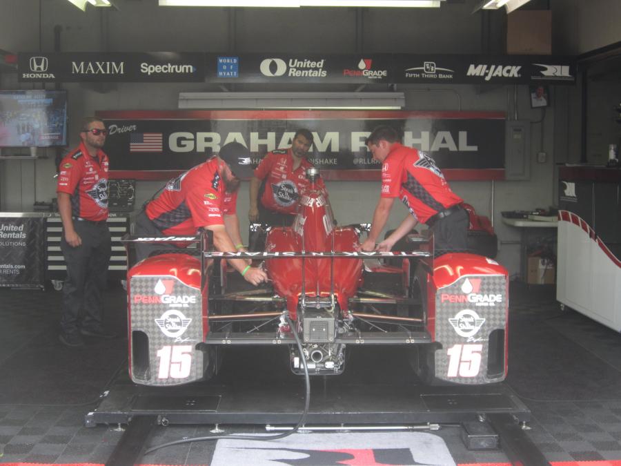 The technicians work on the Rahal Letterman Lanigan #15 car.