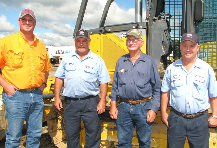 Checking out some dozers of interest (L-R) are Stephen Posey, Steve Lowe, Harold Lowe (founder) and Eddie Lowe, all of Lowe Brothers Logging, Carrollton, Ala.