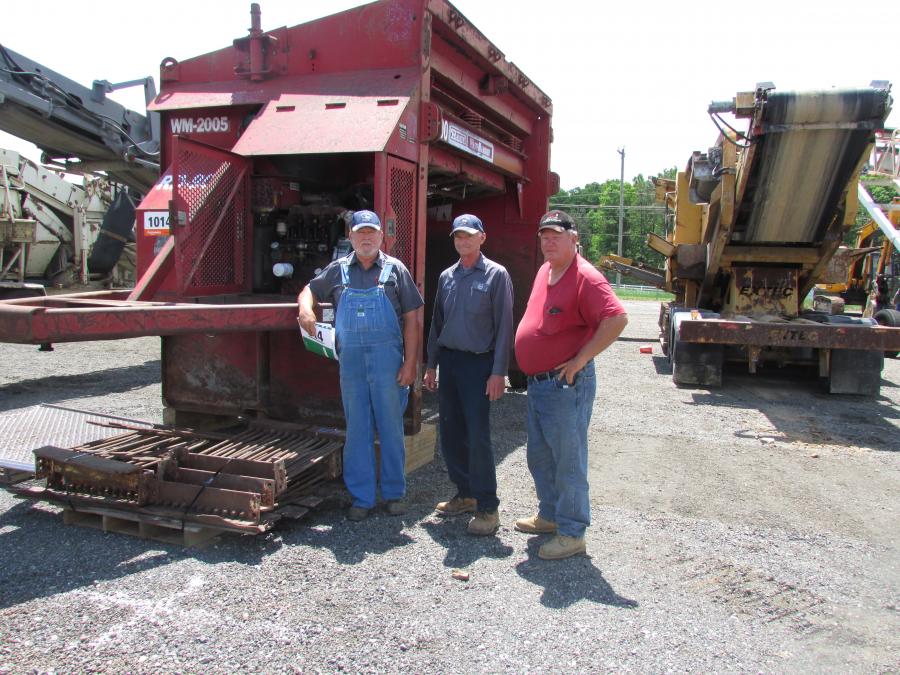 (L-R): Jim Cheeseman and David Hitchner, both of C&H Disposal Service, Elmer, N.J., talk with David Gates of Gates Excavating, Cedarville, N.J.