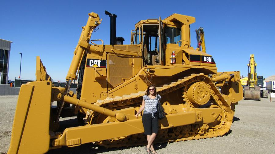 Beauty and the Beast: Eva Kosik, owner of Kosik Construction Ltd., traveled from Edmonton, Canada, to help her daughter, Rachelle Kosik Graham of Las Vegas, purchase her first piece of auction equipment. This Caterpillar D9N crawler tractor may make their list.
