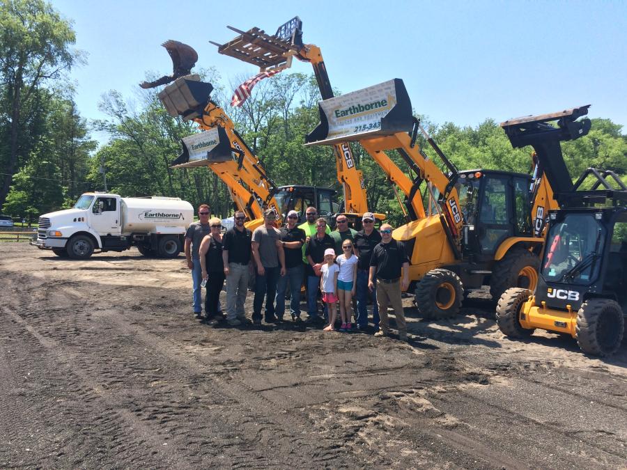Doug Taylor (3rd from L), son of founder and vice president of Earthborne JCB, and the team who brings the Dancing Diggers to life, prepare for another show at the June Fete.
