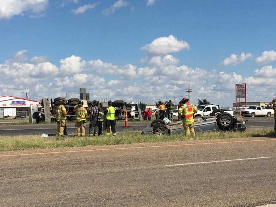 The crane took evasive action to avoid the Dodge Magnum, but still collided with the car. The crane went on to the center median and flipped onto its side. (Photo Credit: KCBD)
