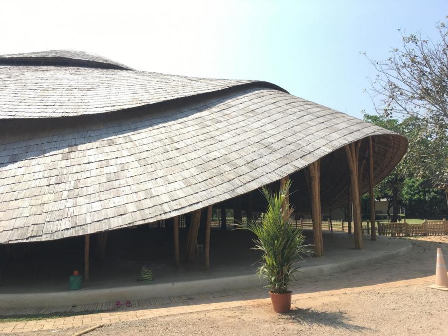 The Panyaden International School in Thailand partnered with Chiangmai Life Architects to build the arena with bamboo — a construction material strong enough to hold up under bad weather, and cool enough to support an open, ventilated floor plan. (Photo Credit: TechXplore)