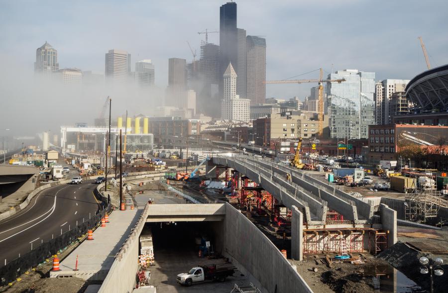 Foggy morning view of the future south portal of the SR 99 tunnel — The future northbound SR 99 off-ramp bridge to South Dearborn Street takes shape just west of Seattle’s stadiums in this November 2016 photo. The bridge sits between the northbound tunnel entrance on the left and the northbound tunnel on-ramp to the right.
(WSDOT photo)