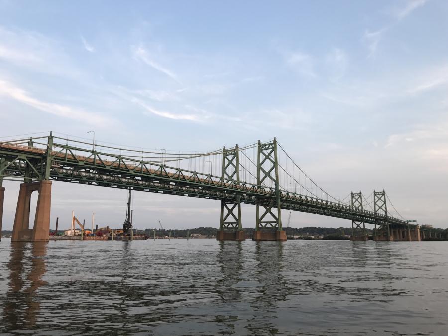 More commonly known together as the Interstate 74 Bridge, the twin suspension spans transport about 80,000 vehicles across the Mississippi River each day between Bettendorf, Iowa, and Moline, Ill.
